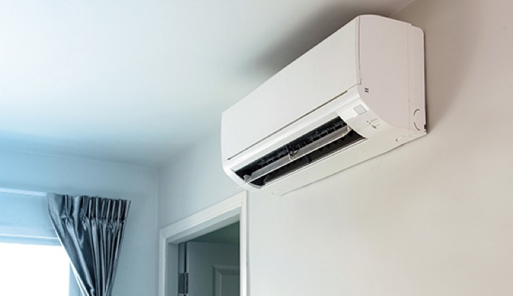 A split system aircon unit installed on a wall.